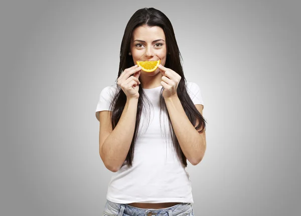 Woman with an orange smile Stock Photo