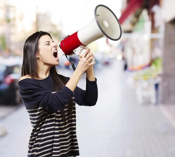 Woman with a megaphone Stock Photo