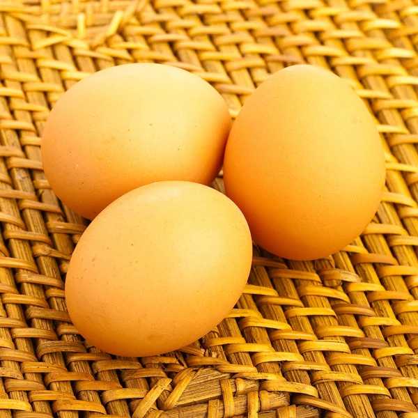 Eggs on wicker — Stock Photo, Image