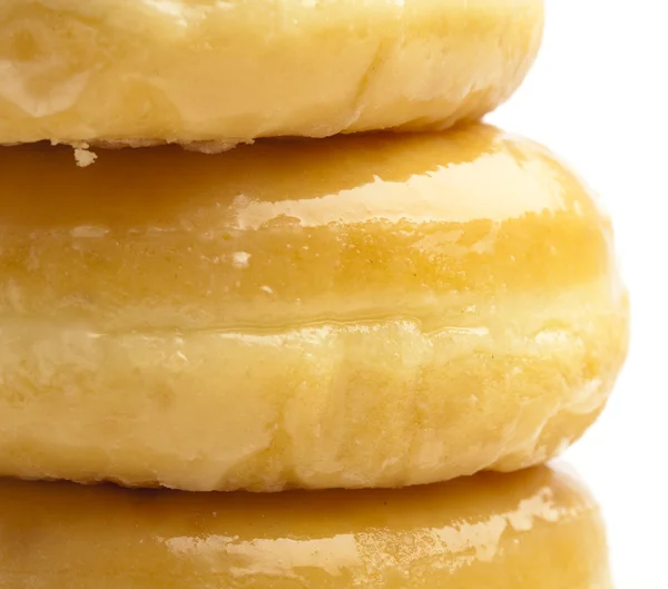 Цукрові пончики екстремально крупним планом на білому тлі — стокове фото
