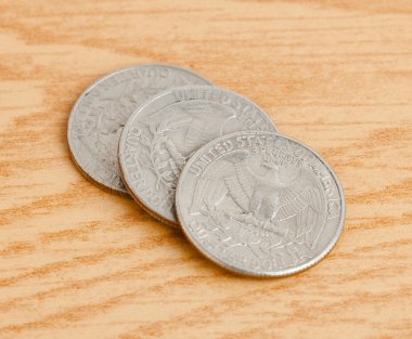 Quarter dollar on table clipart