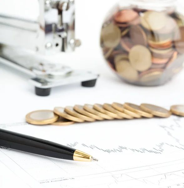 Euro coin and pen and graph — Stock Photo, Image