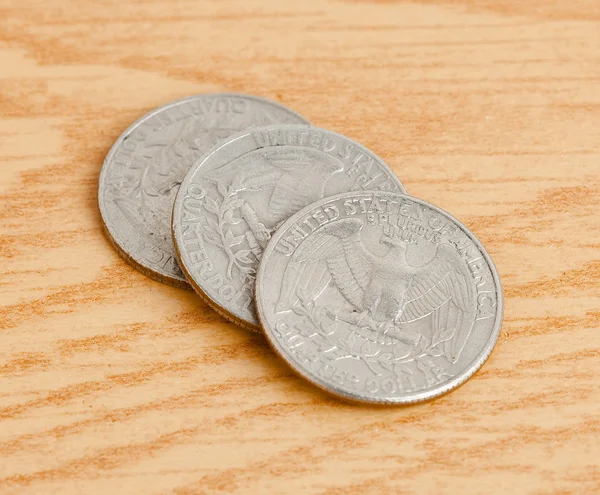 Quarter dollar on table — Stock Photo, Image