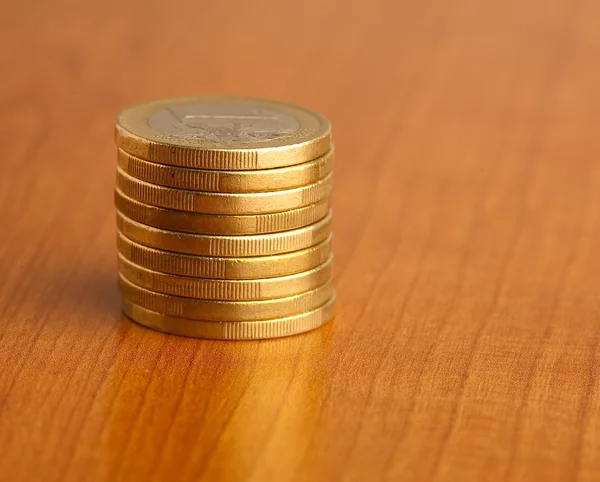 Euro coin on wood — Stock Photo, Image