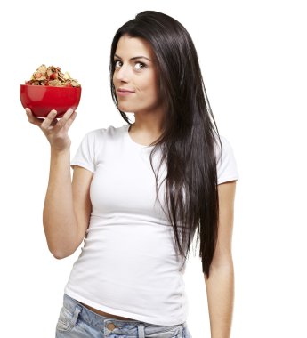 Woman holding a bowl with cereals clipart