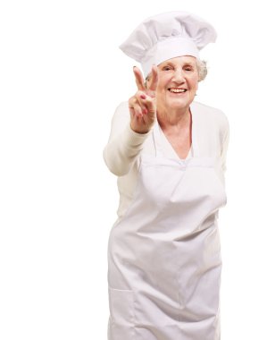 Portrait of cook senior woman doing approval gesture over white clipart