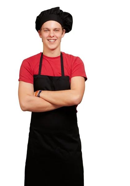 Retrato de jovem cozinheiro vestindo uniforme e sorrindo ao longo do whit — Fotografia de Stock