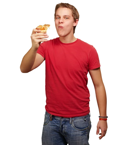 在白 backgorund 年轻男子吃披萨部分的肖像 — 图库照片