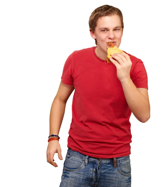 Portrait of young man eating pizza over white background — Stock Photo, Image
