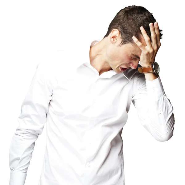 Angry young man doen frustratie gebaar op witte achtergrond — Stockfoto
