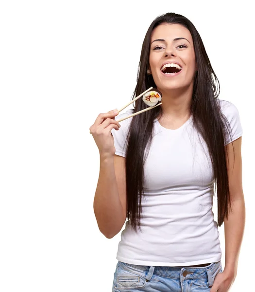 Portrait of young woman holding sushi against a white background — Stock Photo, Image