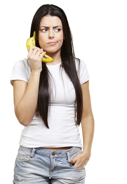 Mulher com um telefone banana — Fotografia de Stock