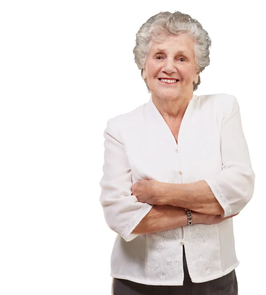 Porträt einer entzückenden Seniorin, die vor weißem Hintergrund steht — Stockfoto
