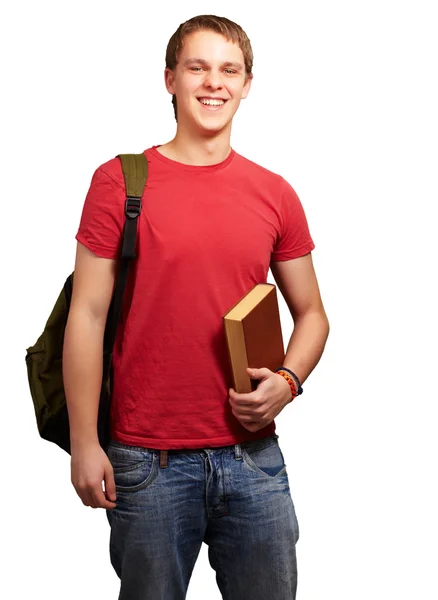 Retrato de jovem estudante segurando livro e carregando mochila ove — Fotografia de Stock