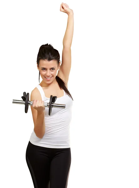 Porträtt av ung kvinna gör gym med vikter över vit ba — Stockfoto