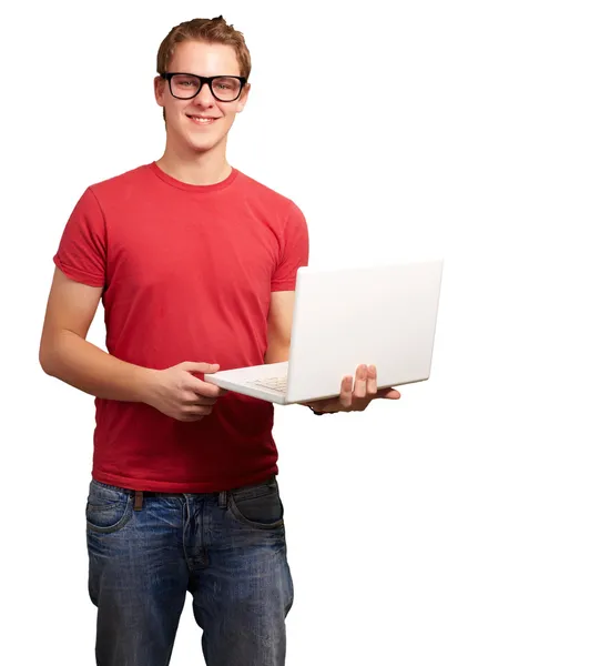 Retrato de un joven estudiante sosteniendo el ordenador portátil sobre fondo blanco —  Fotos de Stock