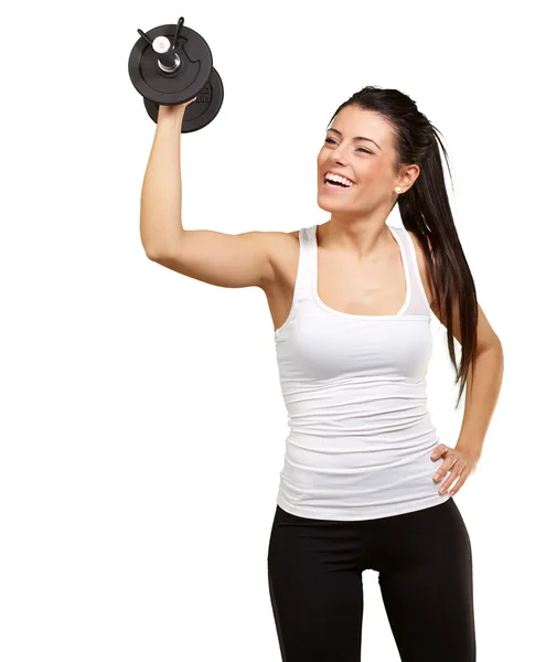Porträtt av ung flicka träning med vikter över vit ba — Stockfoto