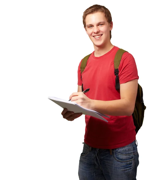 Portret van jonge student man schrijven op een notitieblok over witte b — Stockfoto