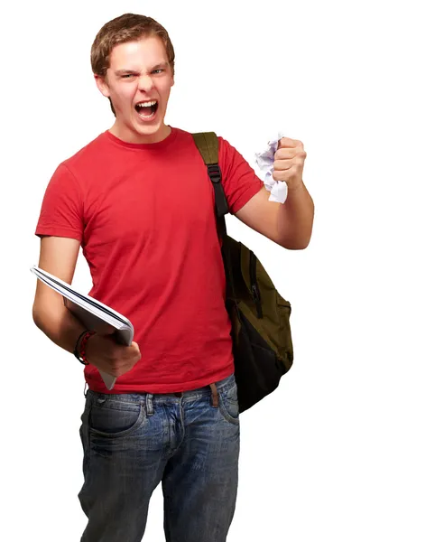 Joven estudiante enojado golpeando una hoja sobre fondo blanco — Foto de Stock