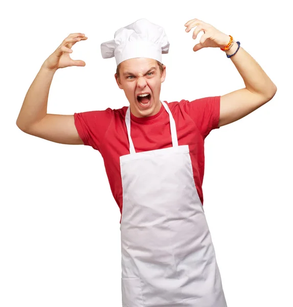 Agresif gestur yapıyor önlük giyen genç aşçı adam portresi — Stok fotoğraf