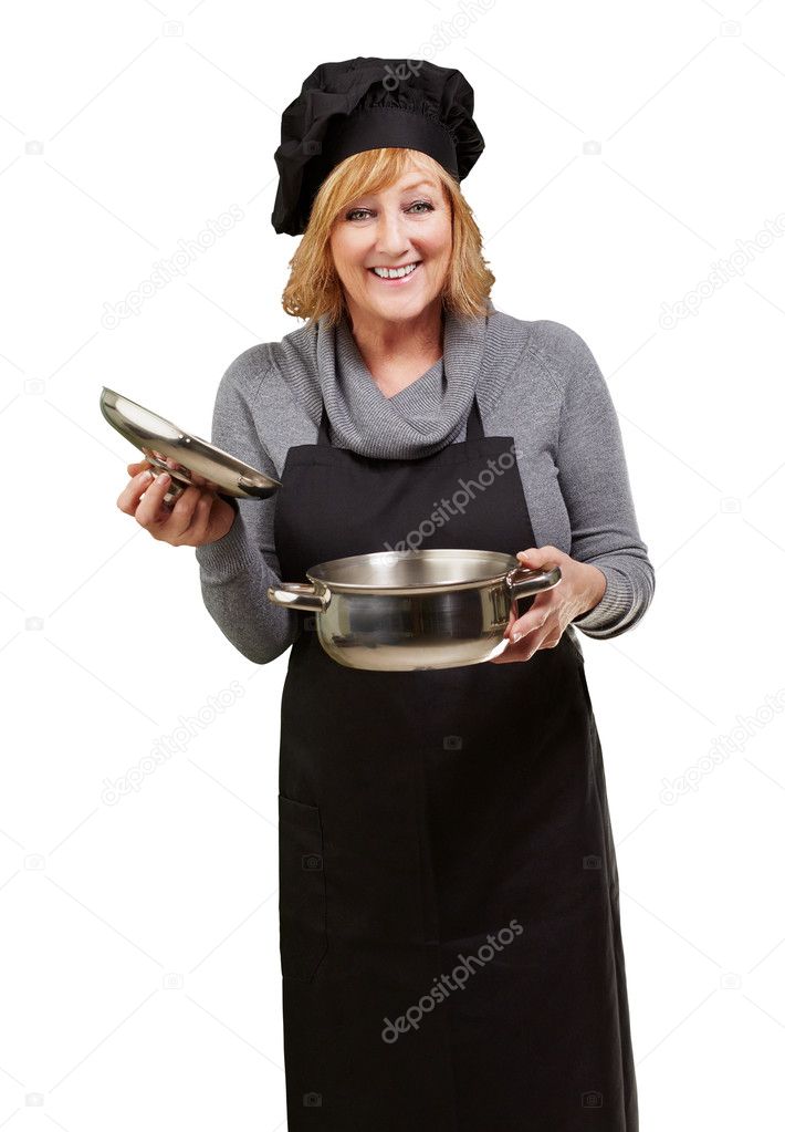 Middle aged cook woman holding a souce pan over white background