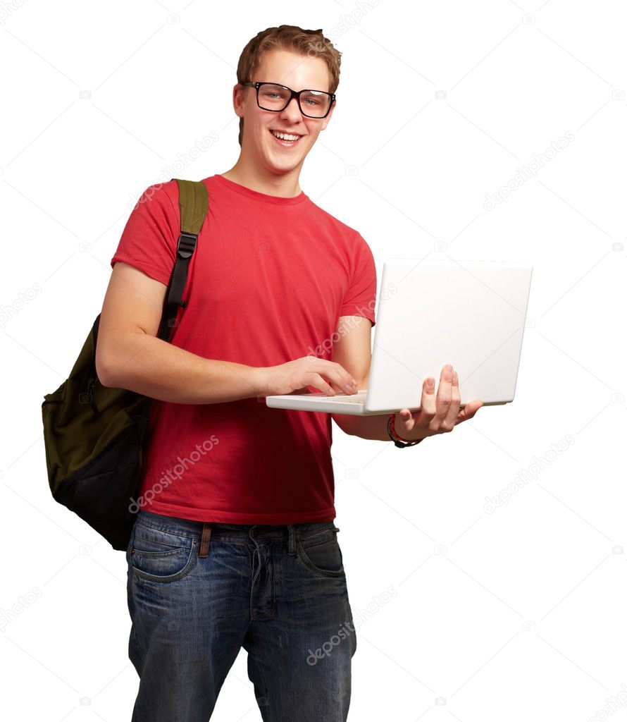 Portrait of young man holding laptop and wearing backpack over w