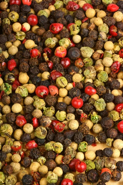 Stock image Four seasons pepper grains background