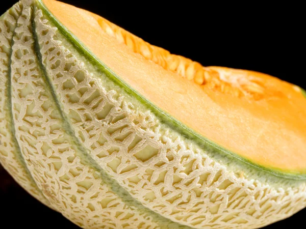 Melone über Schwarz — Stockfoto