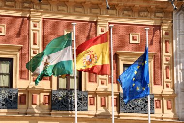Flags at Palace of San Telmo, Seville clipart