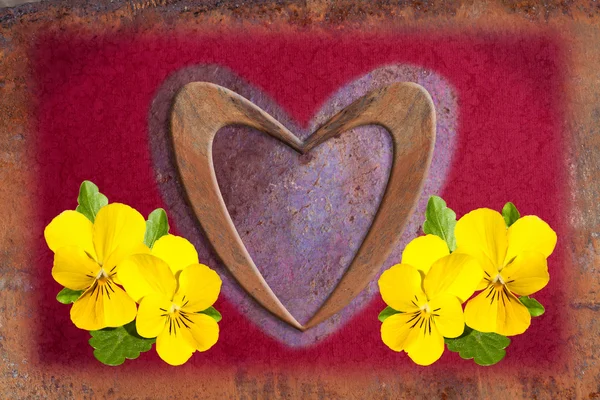 Love heart with yellow violets — Stock Photo, Image