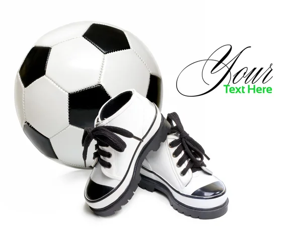 Children's shoes and soccer ball — Stock Photo, Image