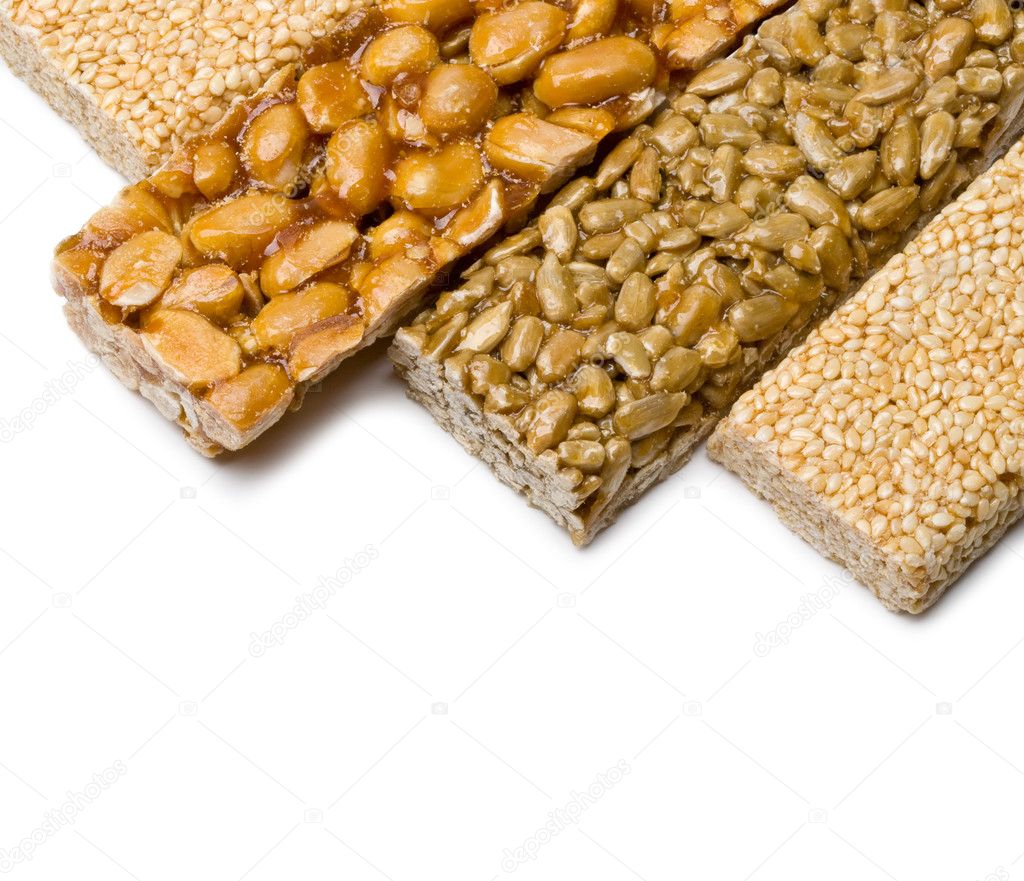 Stock photography ▻ Sunflower seeds, sesame ,peanuts in sugar syrup isolate...
