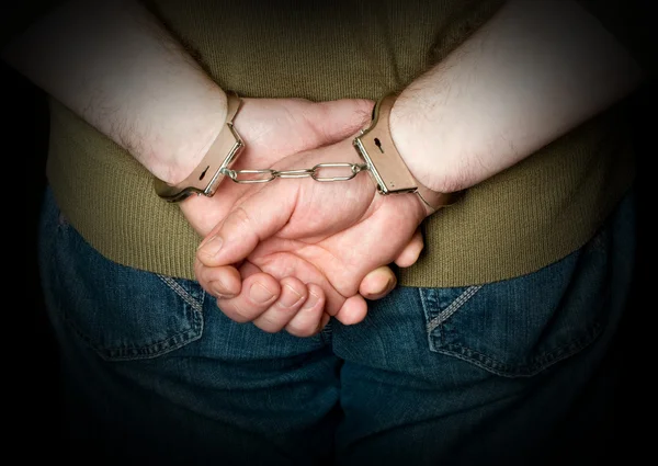 Hands in shackles — Stock Photo, Image
