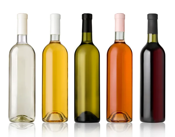 Set of white, rose, and red wine bottles. Royalty Free Stock Photos