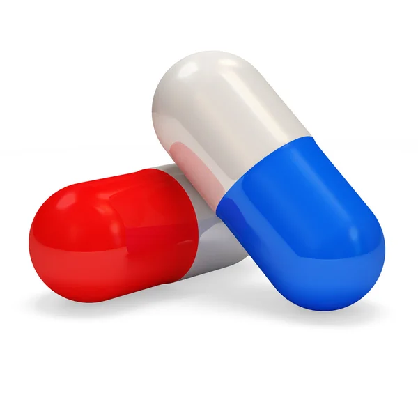 Comprimido vermelho e azul em fundo branco — Fotografia de Stock