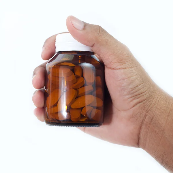 Medicin flaska i en hand — Stockfoto