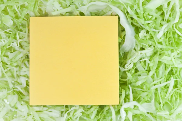 Žlutý papír s zelená zelenina — Stock fotografie