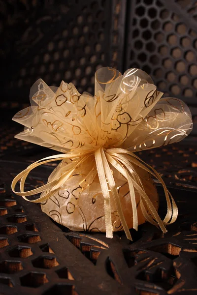 stock image Golden Favour with ribbon