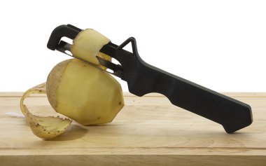 Knife to clean potatoes. clipart