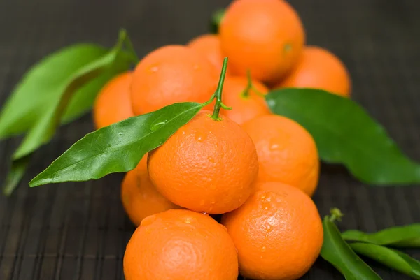 stock image Fresh tangerines on the black