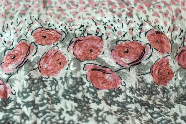 Padrões florais rosa em um tecido cinza — Fotografia de Stock