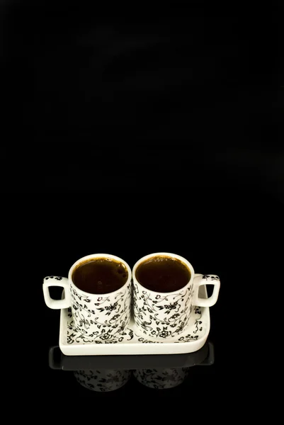 Two cups of Turkish coffee on a black background — Stock Photo, Image