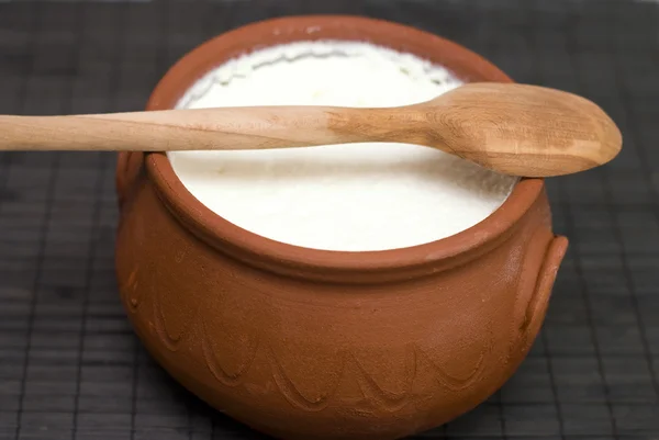 Homemade yogurt in earthenware pot — Stock Photo, Image