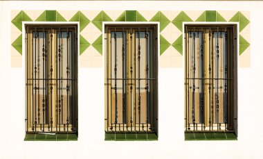 Three windows with grills. clipart