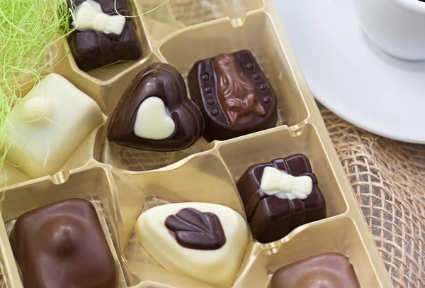Golden box of chocolates. — Stock Photo, Image