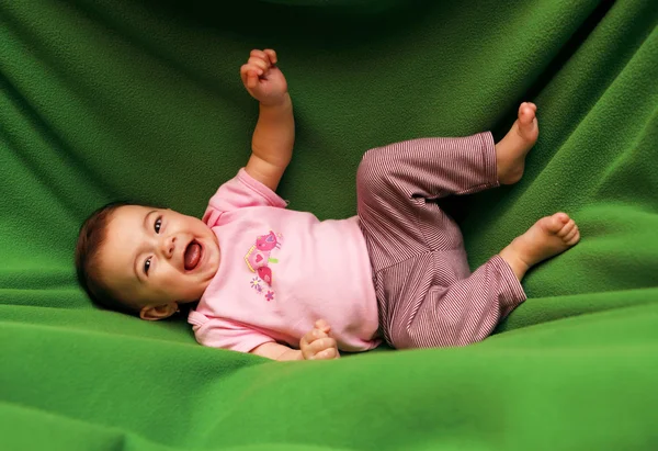 Happy smiling child on blanket — Stock Photo, Image