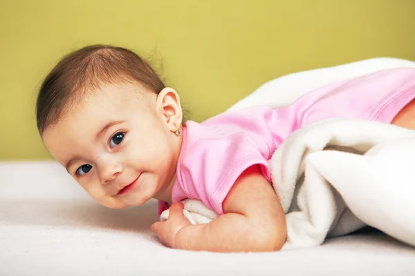 Happy Baby lying on white towel — Stock Photo, Image