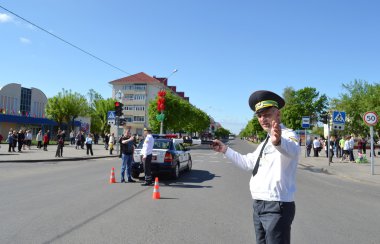 On streets of Slutsk.Staff of GAI keeps order on the road. clipart