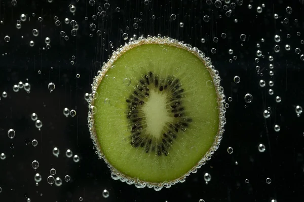 stock image Slice of kiwi fruit in Water 1