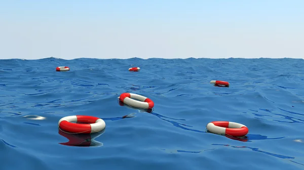 Boyas salvavidas flotando en las olas — Foto de Stock